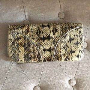 Snake skin clutch bag